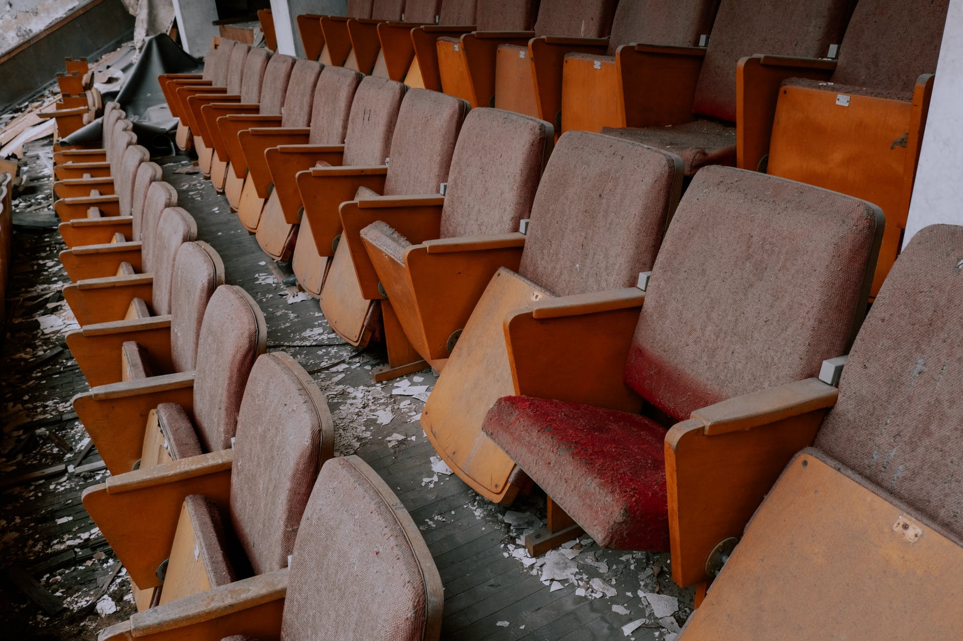 abandoned cinema with broken chairs